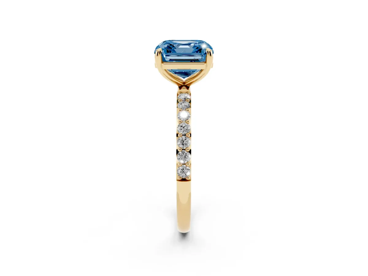 Fancy Blue Asscher Cut Diamond Solitaire Ring with Round Pavé Band and Prong Setting Yellow gold