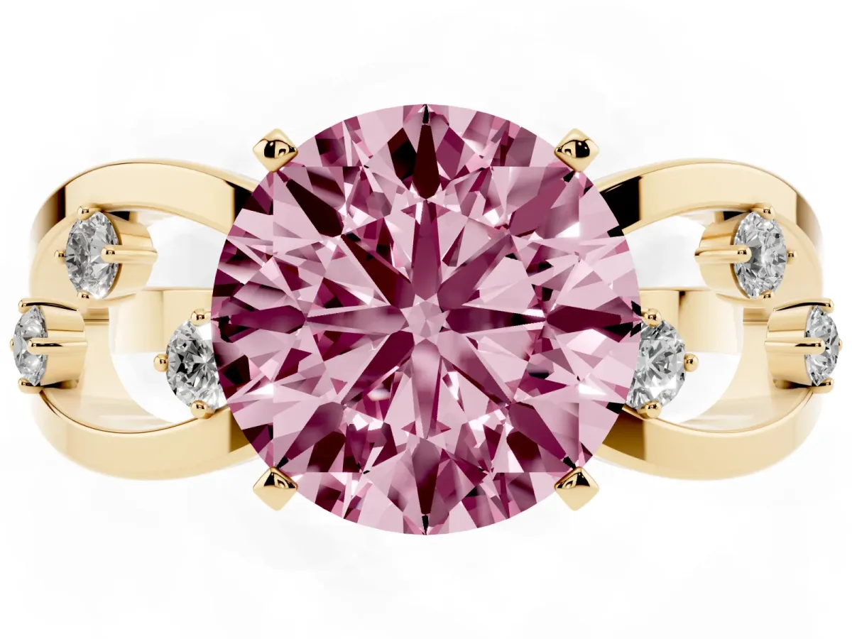 Fancy Pink Round Cut Cut Solitaire Diamond with Side Stones on Criss-Cross Band and Four-Prong Setting Yellow gold