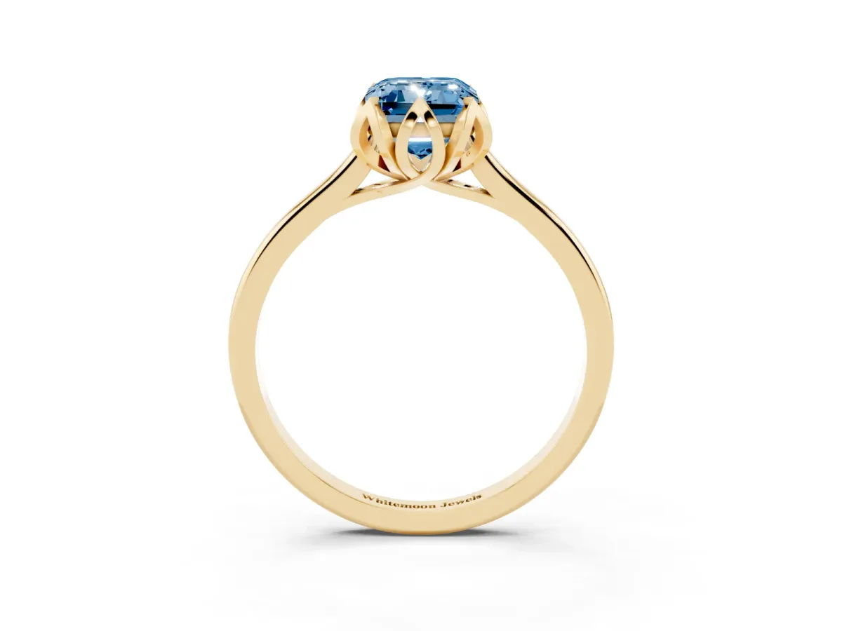 Fancy Blue Emerald Cut Diamond Solitaire Ring with Flower Prong Setting and Classic Band Yellow gold