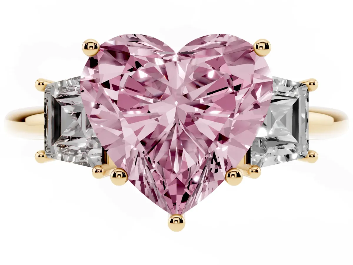 Fancy Pink Heart Cut Diamond Three-Stone Ring with Trapezoid Side Stones and Prong Setting Yellow gold