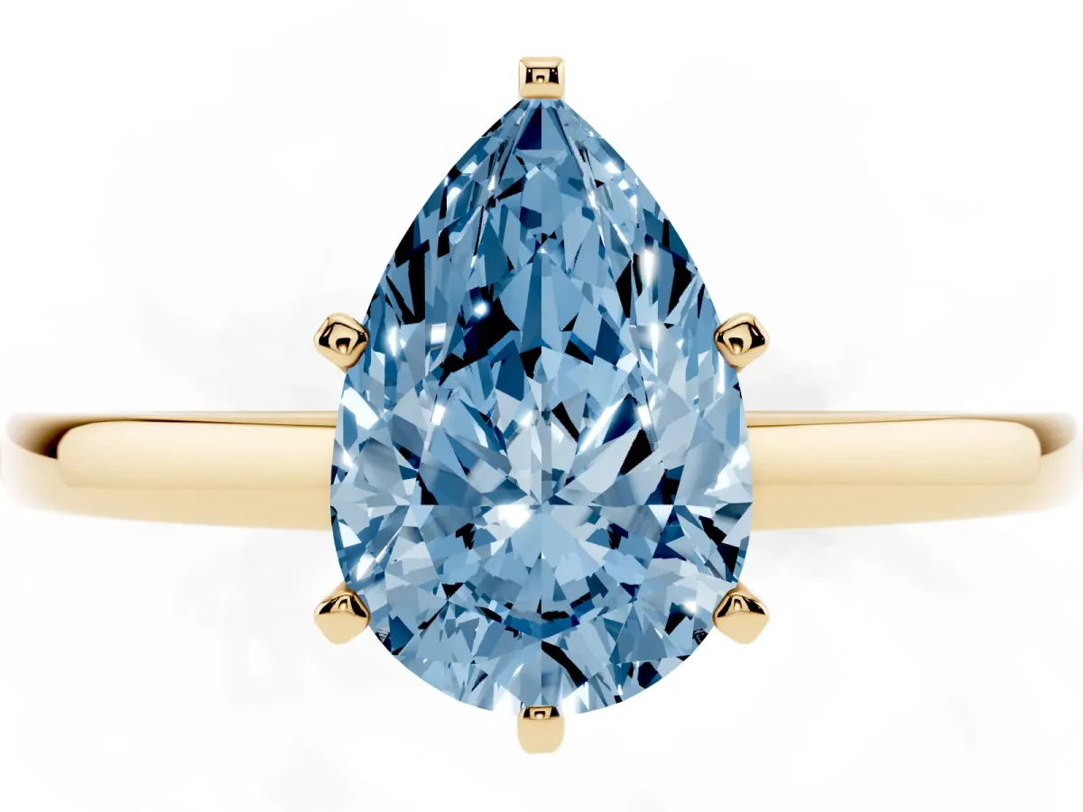 Fancy Blue Pear Cut Solitaire Diamond Engagement Ring with Four-Prong Setting on a Classic Band Yellow gold