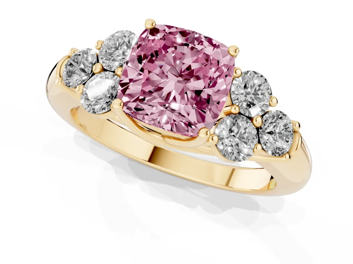 Fancy Pink Cushion Cut Cut Diamond Cluster Ring with Round Accent Stones and Prong Setting on a Classic Band Yellow gold