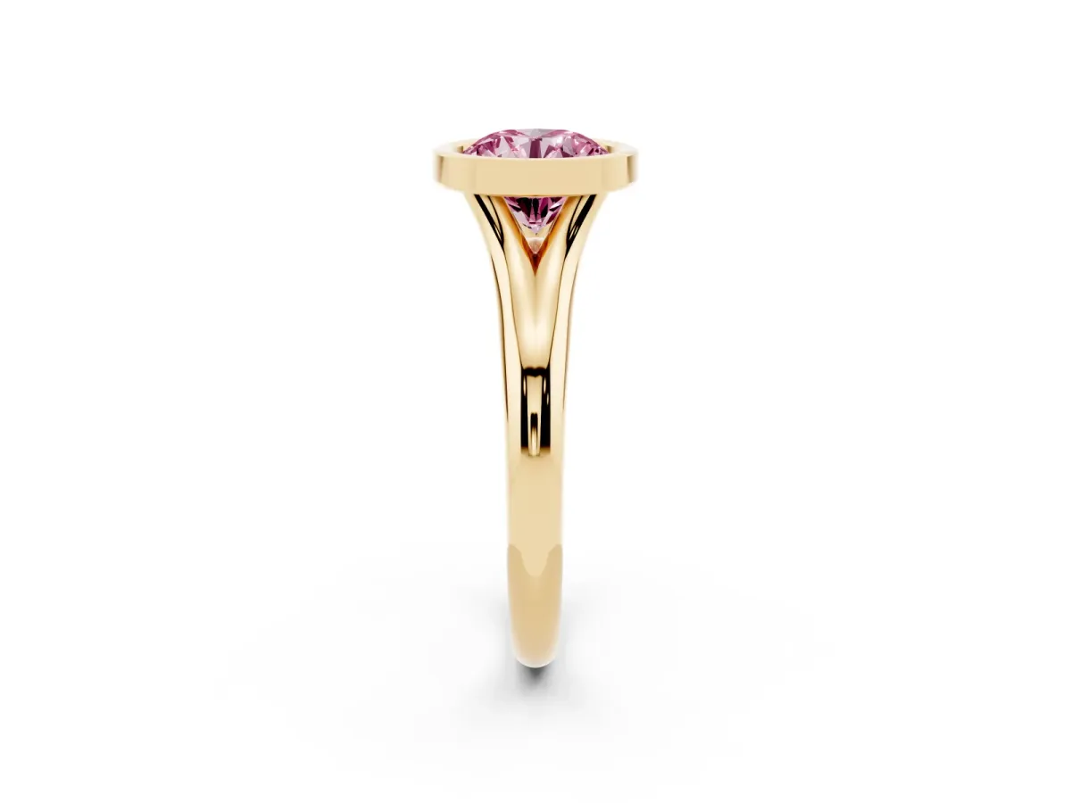 Fancy Pink Bezel Set Round Cut Solitaire Diamond Ring with Smooth Band Yellow gold