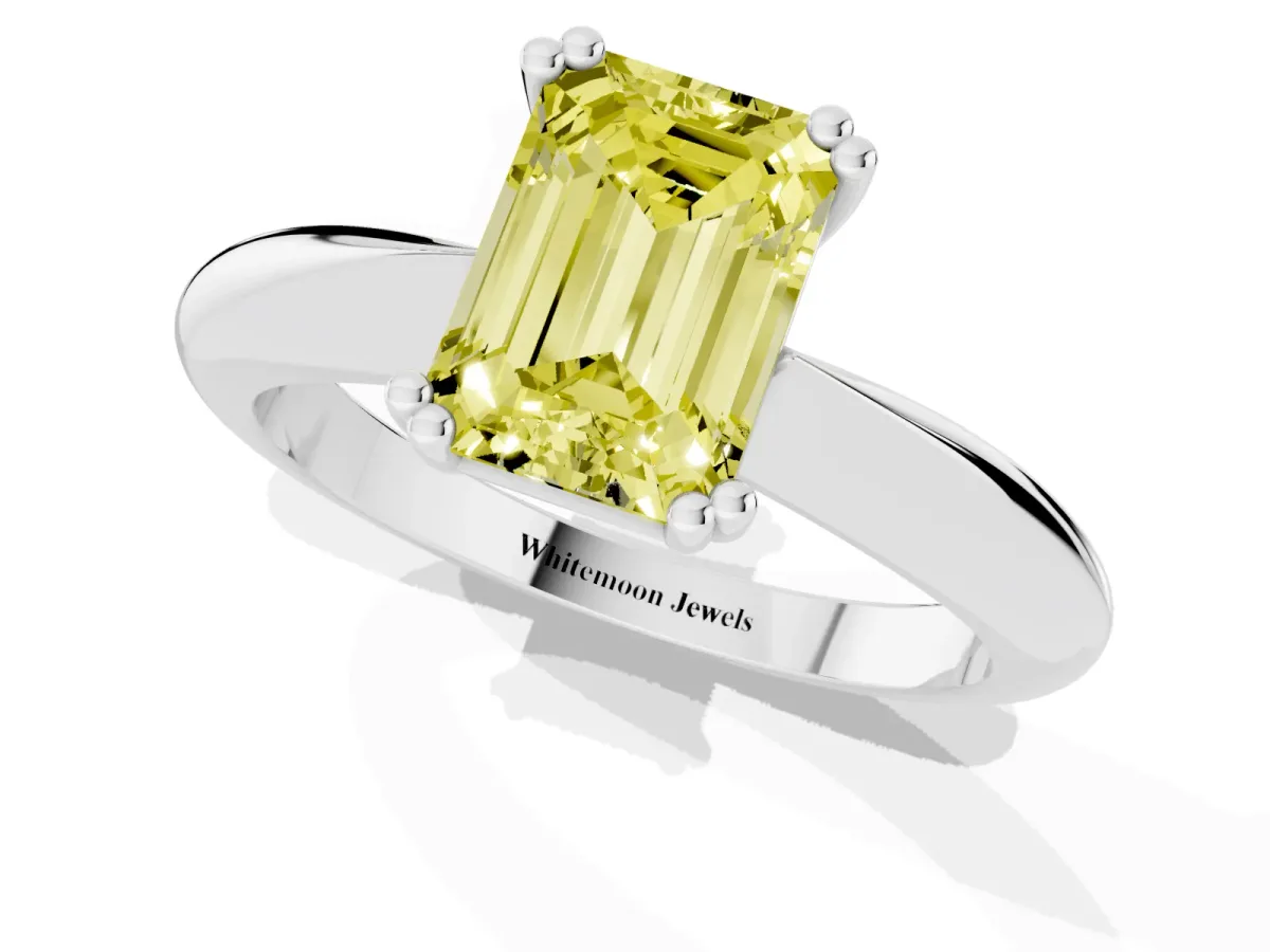 Fancy Yellow Emerald Cut Cut Solitaire Engagement Ring with Tapered Band and Four-Prong Setting Silver
