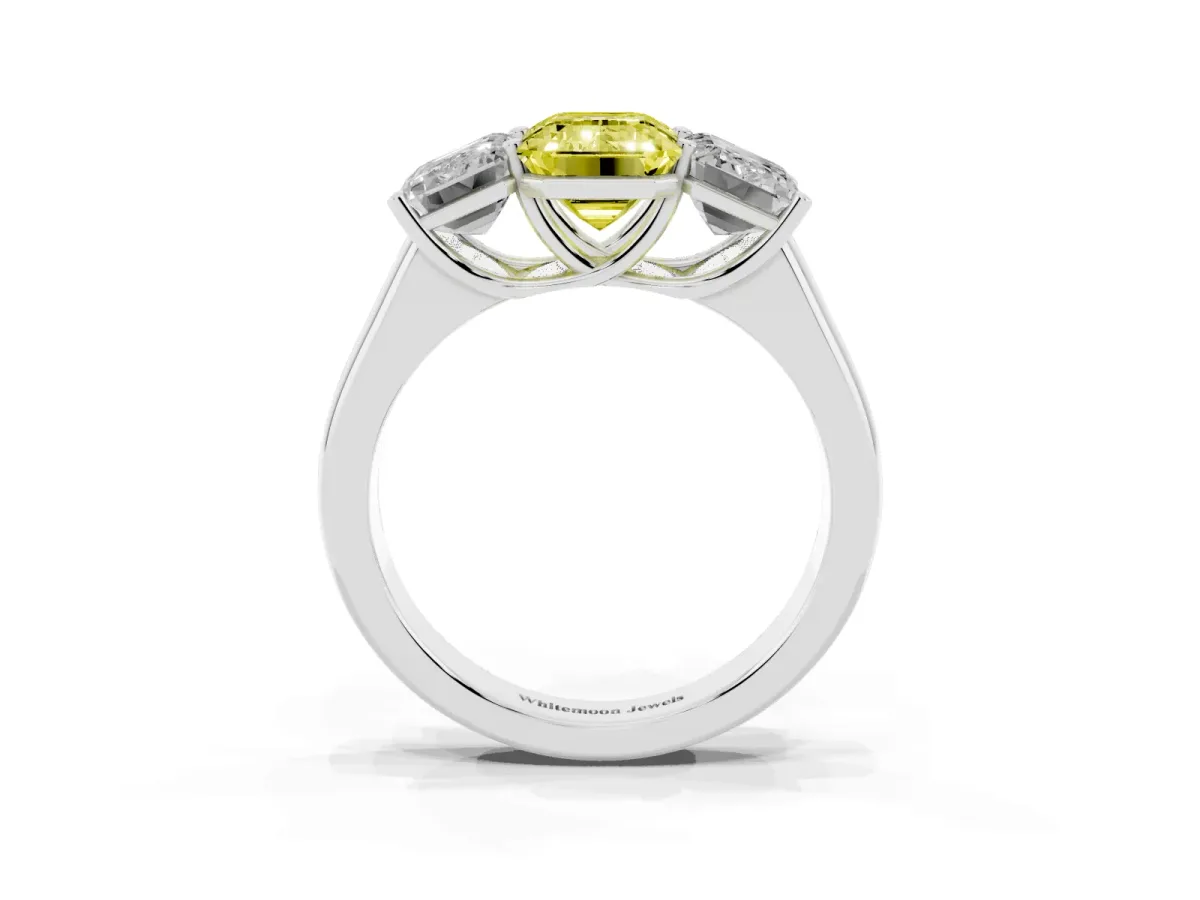 Fancy Yellow Emerald Cut Three-Stone Diamond Ring with Prong Setting on a Classic Band Silver
