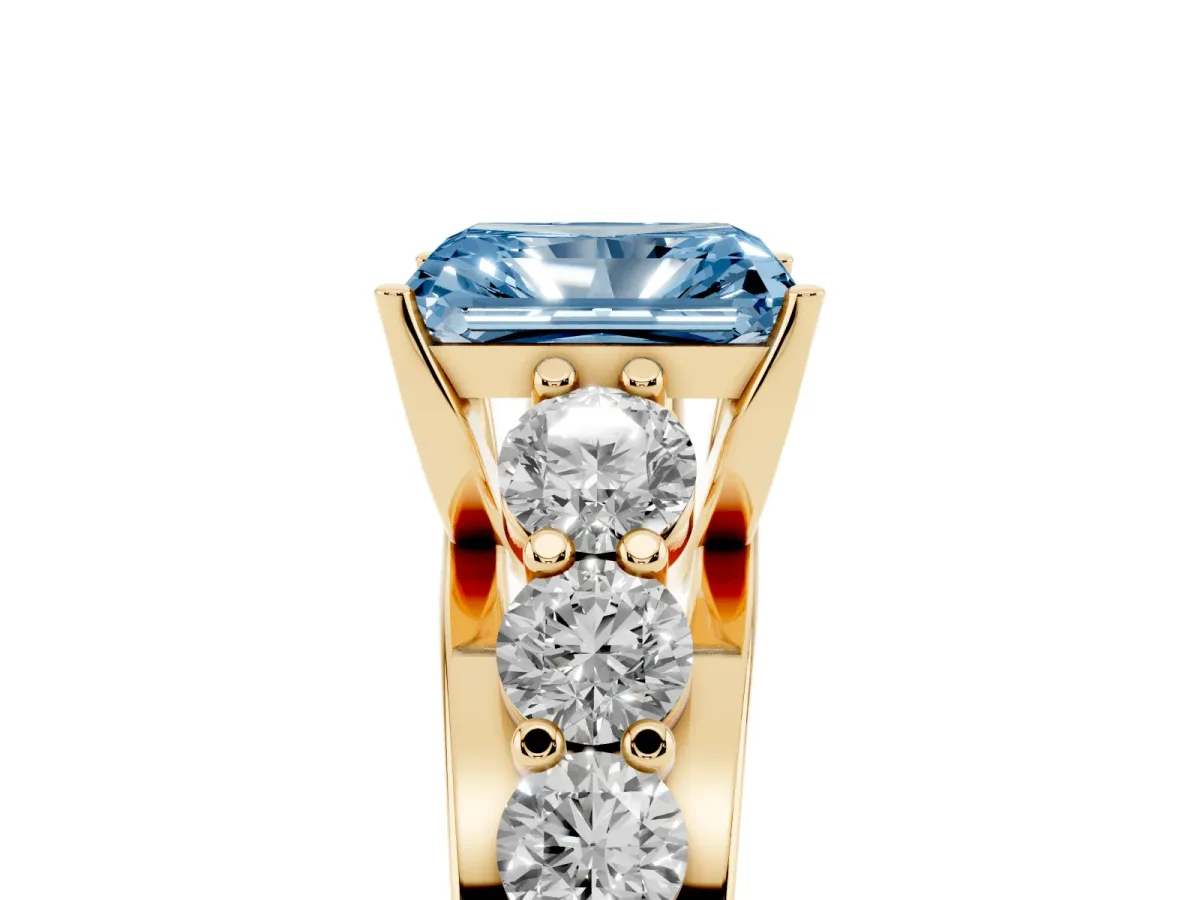 Fancy Blue Radiant Cut Diamond Engagement Ring with Pavé Band and Four-Prong Setting Yellow gold