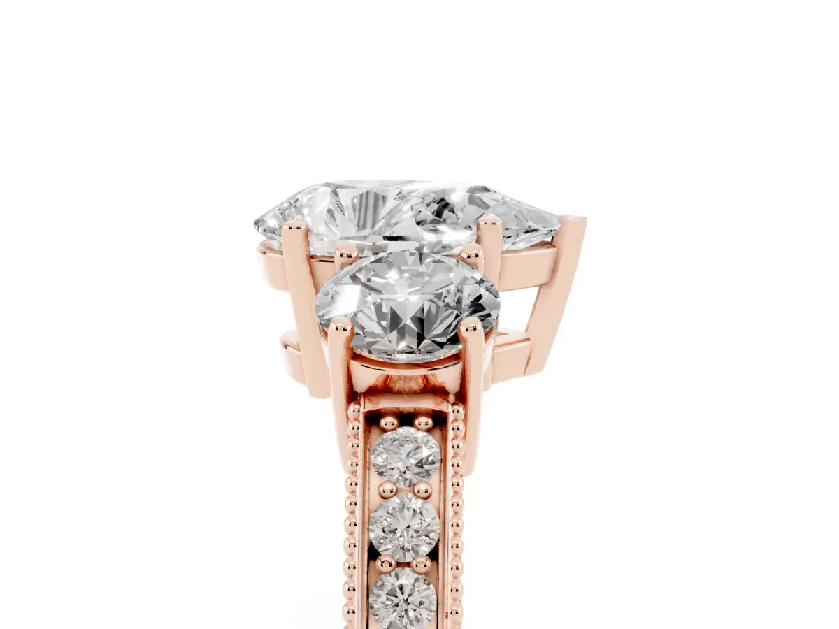 Pear Cut Three-Stone Diamond Ring with Pavé Band and Four-Prong Setting Rose gold