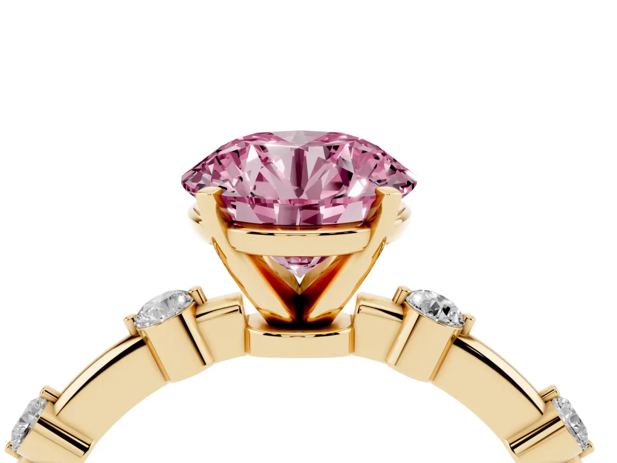 Fancy Pink Round Cut Solitaire Diamond Ring with Bezel Set Side Stones and Prong Setting Yellow gold