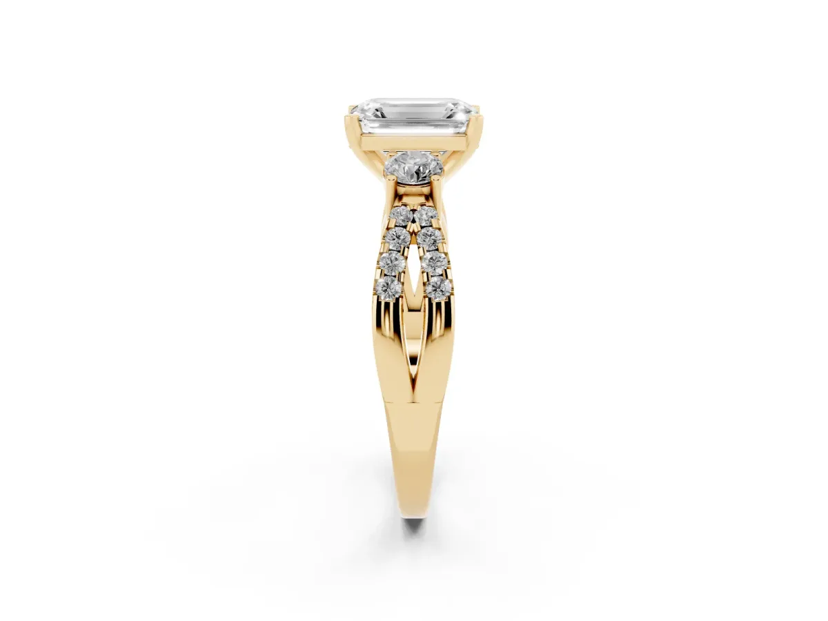 Emerald Cut Diamond Three-Stone Ring with Pavé Split Shank and Four-Prong Setting Yellow gold