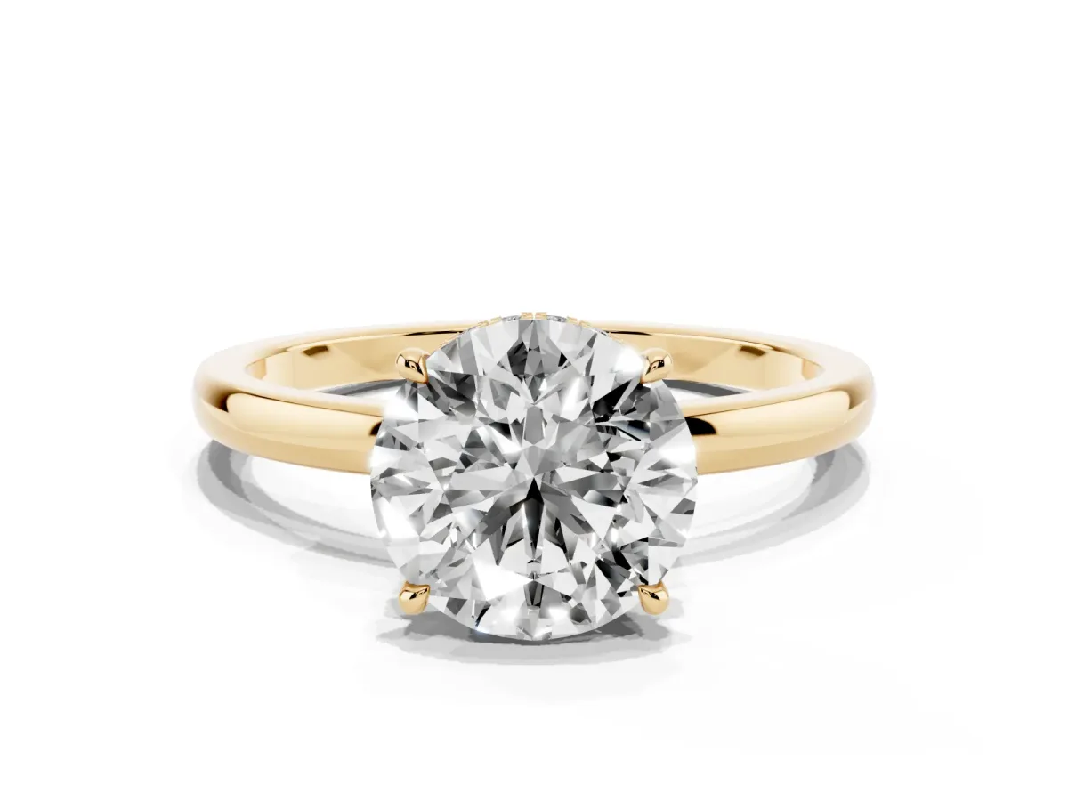 Round Cut Solitaire Engagement Ring with Cathedral Band and Four-Prong Setting Yellow gold