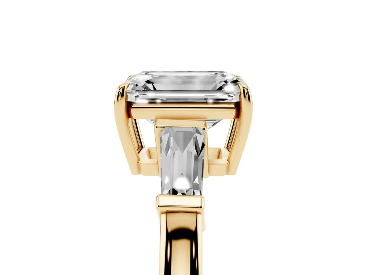 Emerald Cut Diamond Three-Stone Ring with Tapered Baguette Side Stones and Prong Setting Yellow gold