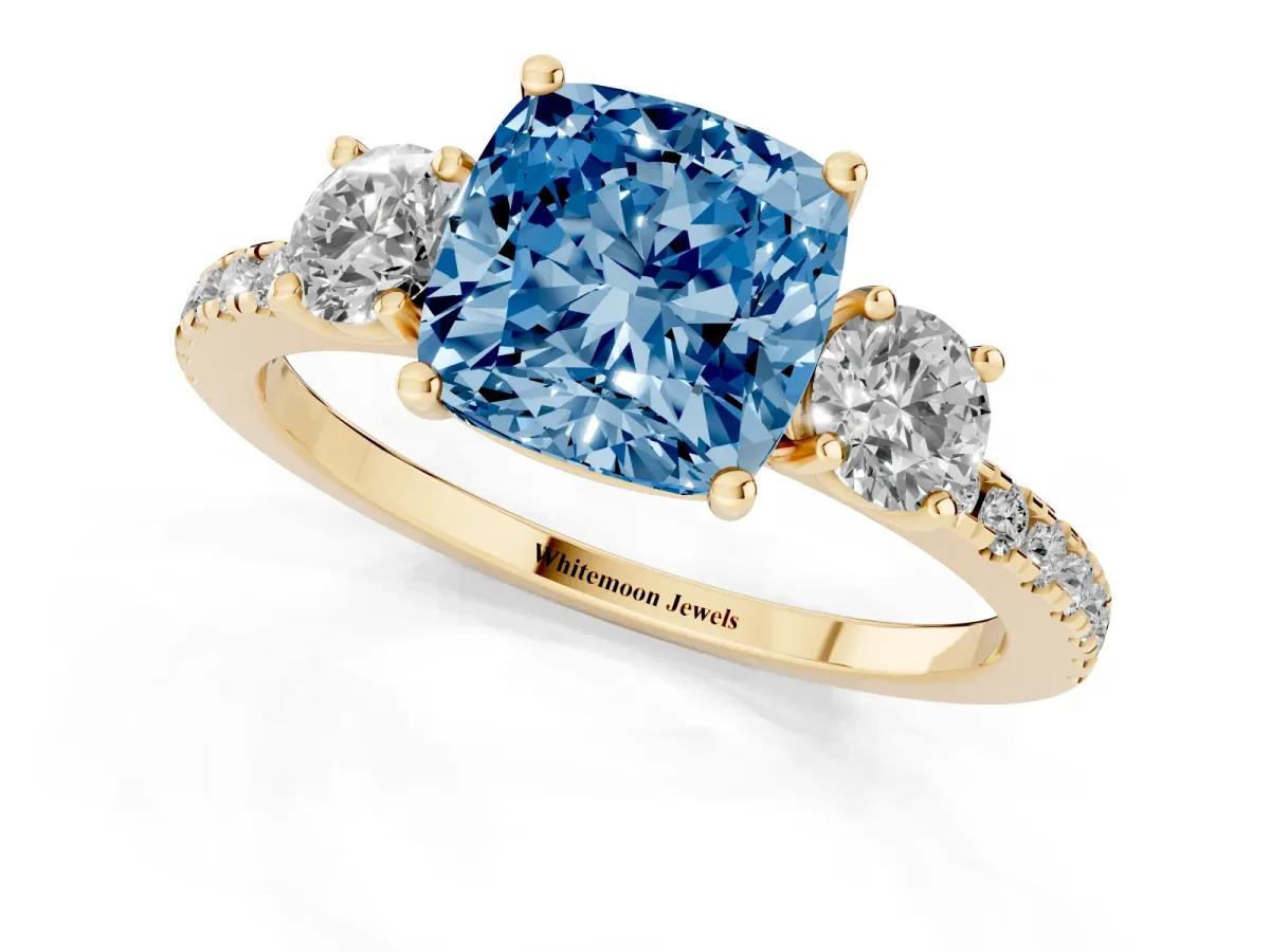 Fancy Blue Three-Stone Cushion Cut Cut Diamond Pavé Band with Prong Setting Yellow gold