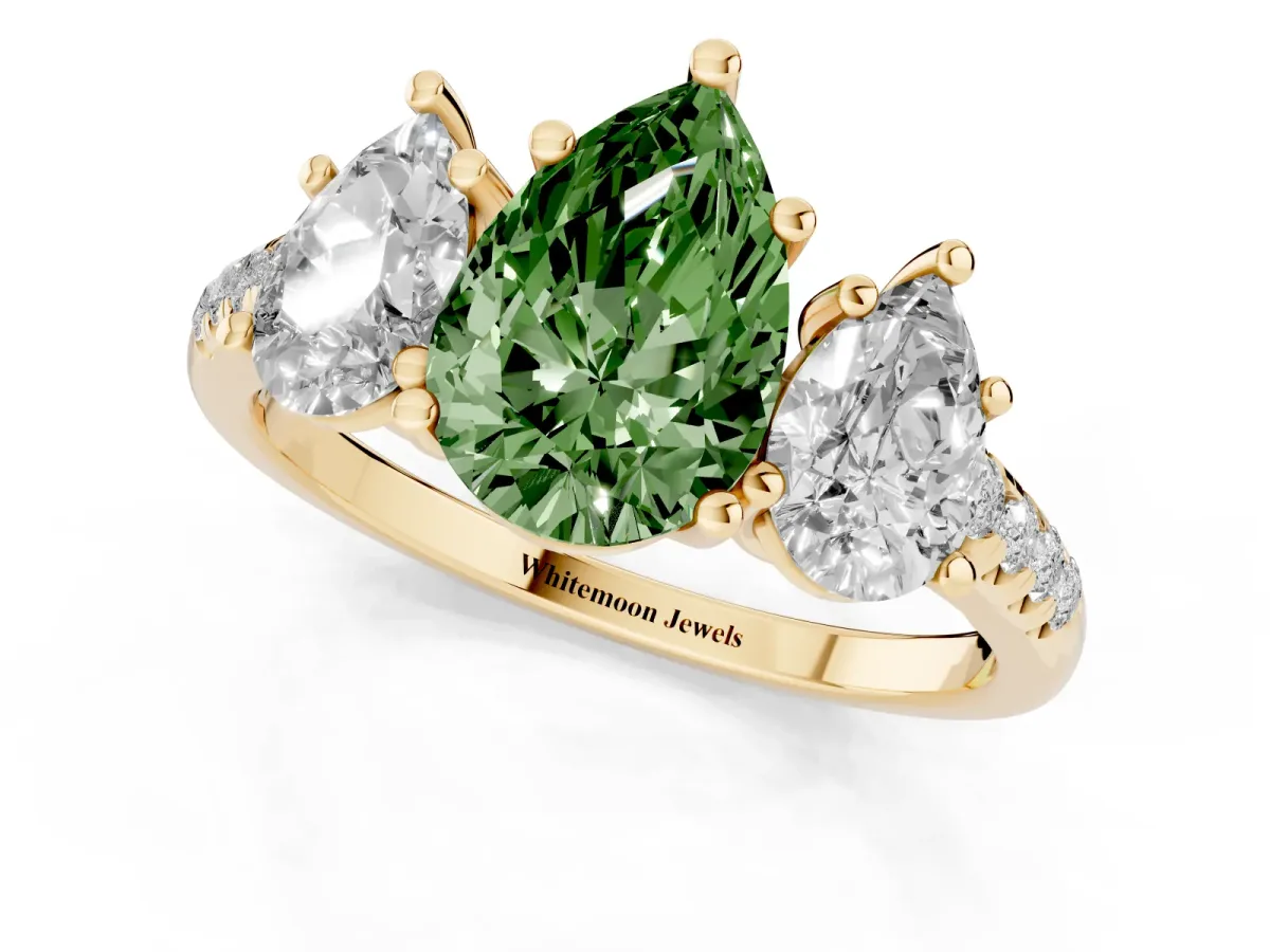 Fancy Green Three-Stone Pear Cut Diamond Ring with Round Pavé Band and Prong Setting Yellow gold