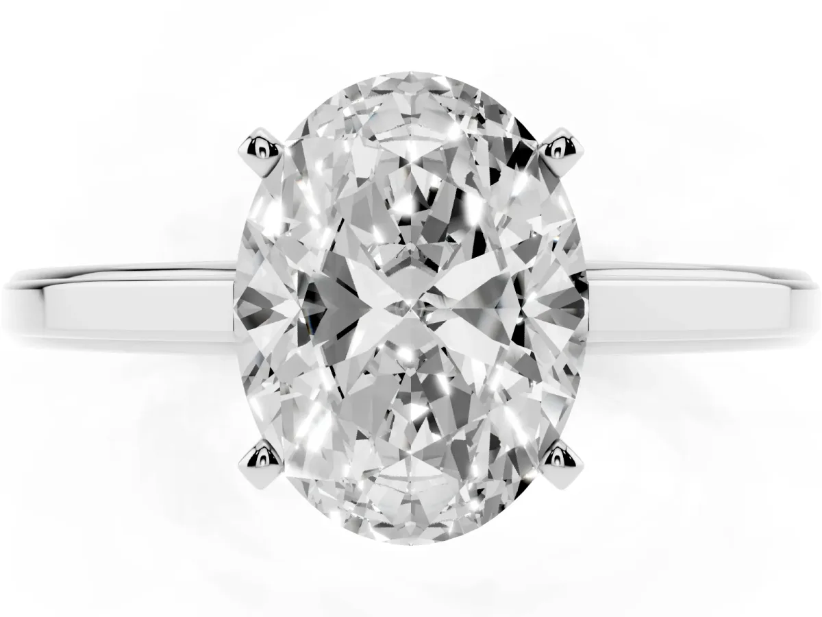 Oval Cut Solitaire Diamond Ring with Four-Prong Setting and Classic Band Silver