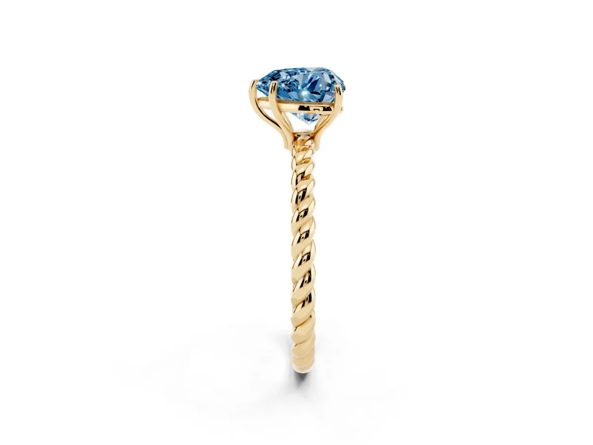 Fancy Blue Heart Cut Solitaire Twist Band Ring with Four-Prong Setting Yellow gold