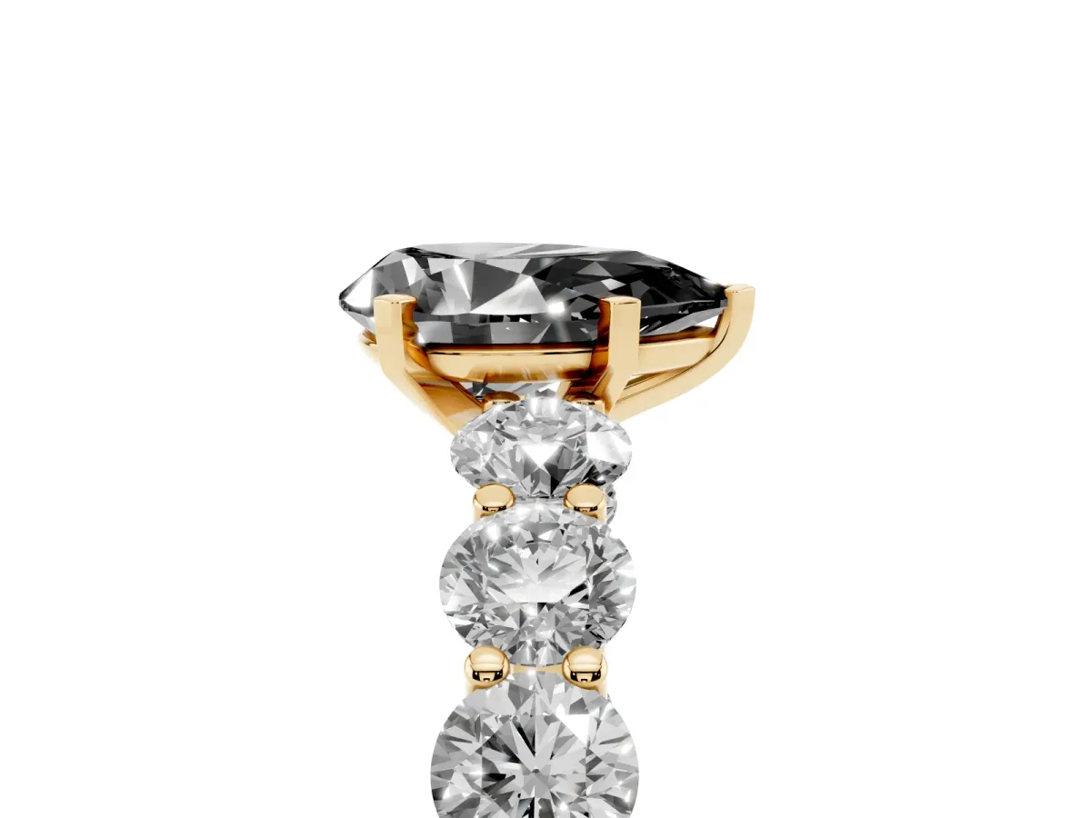 Fancy Black Pear Cut Diamond Prong Setting with Side Stones on a Pave Band Yellow gold