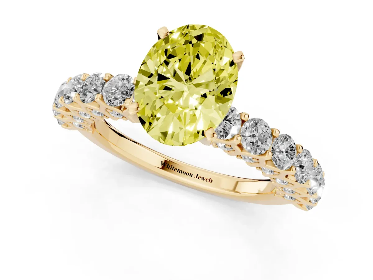 Fancy Yellow Oval Cut Diamond Solitaire Ring with Shared Prong Pavé Band and Four-Prong Setting Yellow gold