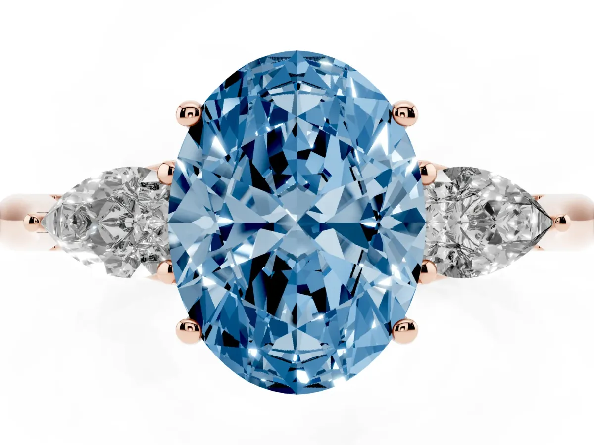 Fancy Blue Three-Stone Oval Cut Diamond Ring with Pear Side Stones in Four-Prong Setting Rose gold