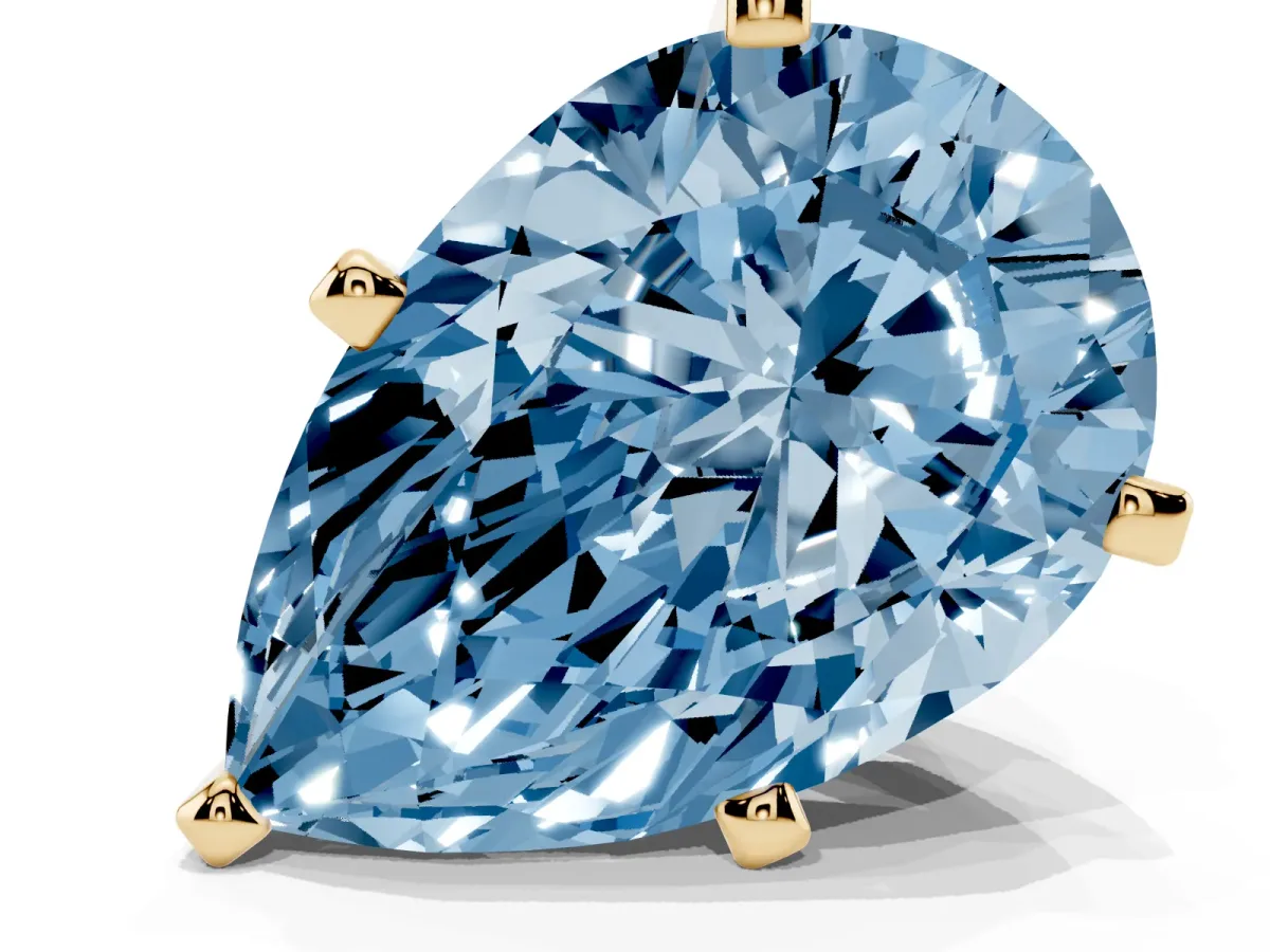 Fancy Blue Pear Cut Diamond Solitaire Ring with Prong Setting and Classic Band Yellow gold