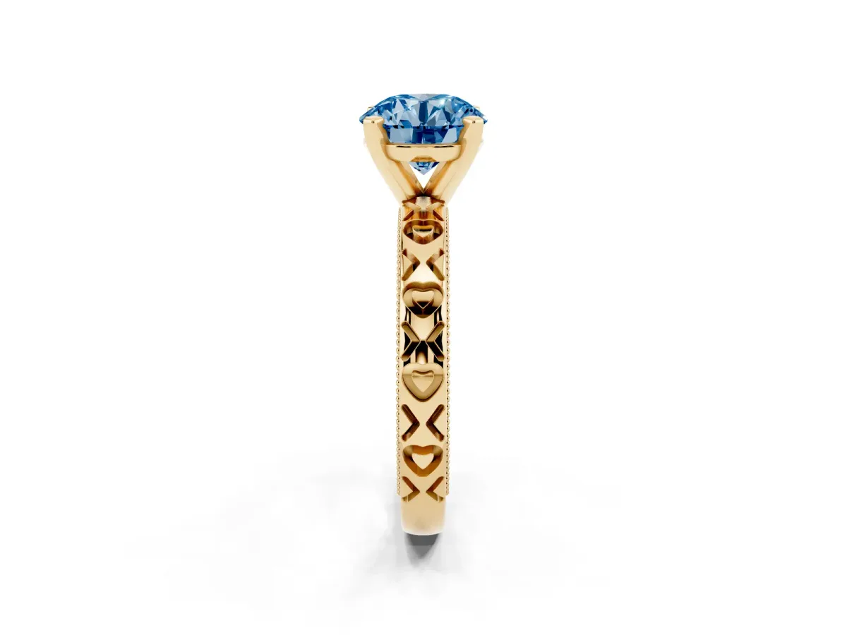 Fancy Blue Round Cut Solitaire Diamond Engagement Ring with XO Engraved Band and Four-Prong Setting Yellow gold