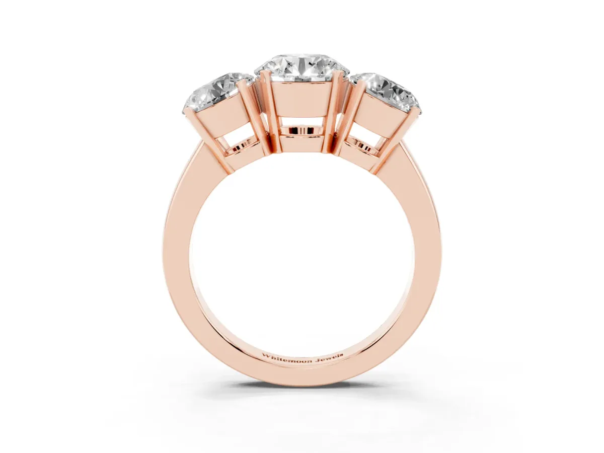 Three-Stone Round Cut Cut Diamond Ring with Channel Set Band and Four-Prong Setting Rose gold