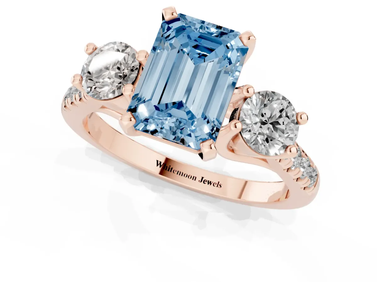 Fancy Blue Three-Stone Emerald Cut Diamond Pavé Band with Four-Prong Setting Rose gold
