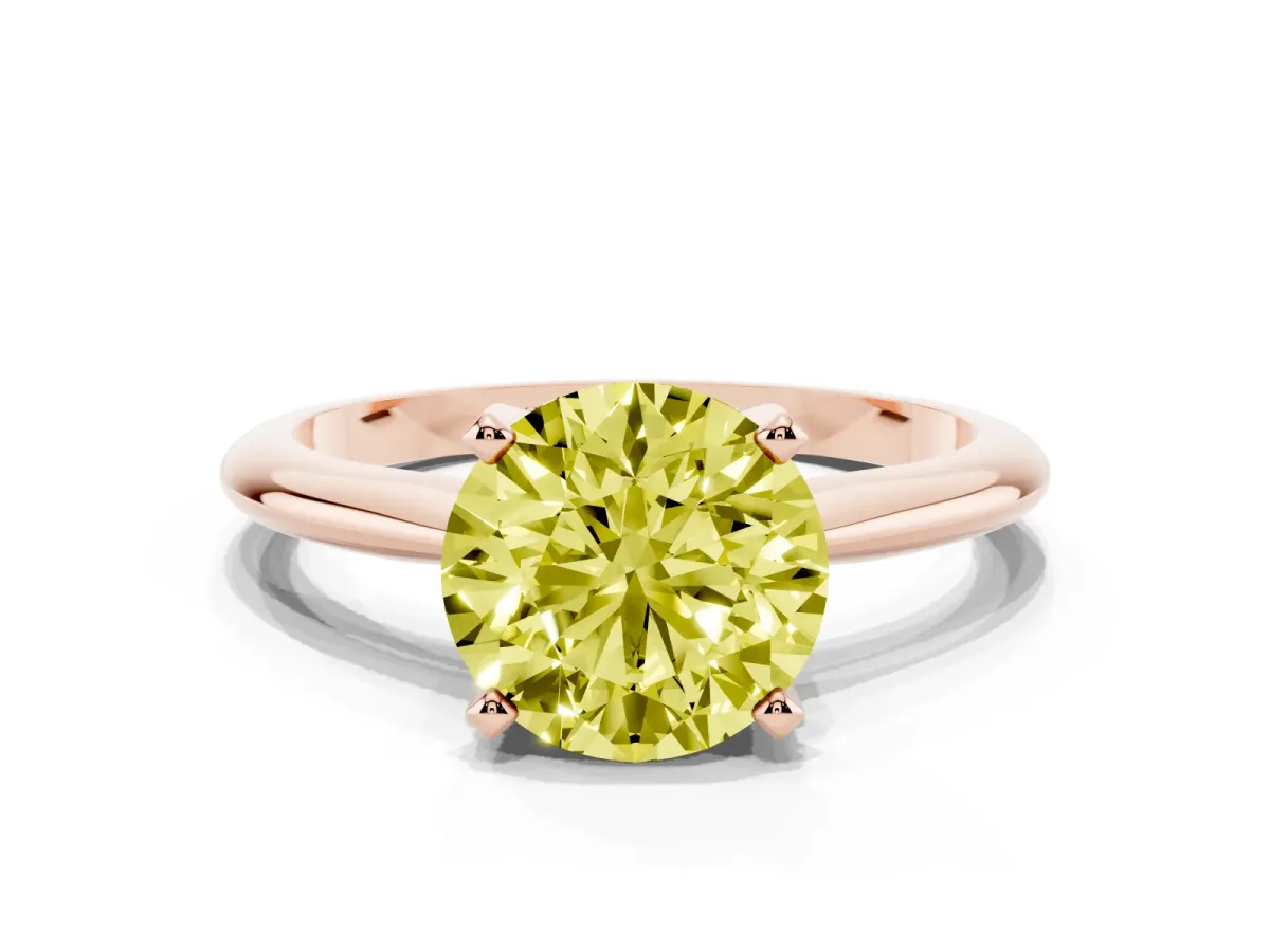 Fancy Yellow Round Cut Cut Solitaire Ring with Four-Prong Setting on a Classic Band Rose gold