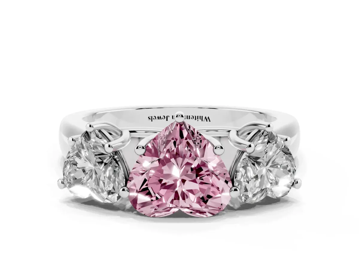 Fancy Pink Heart Cut Three-Stone Diamond Ring with Prong Setting on a Classic Band Silver