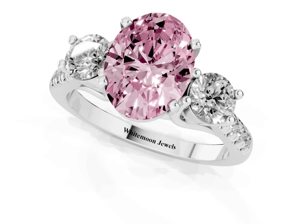 Fancy Pink Three-Stone Oval Cut Diamond Pavé Band with Four-Prong Setting Platinum