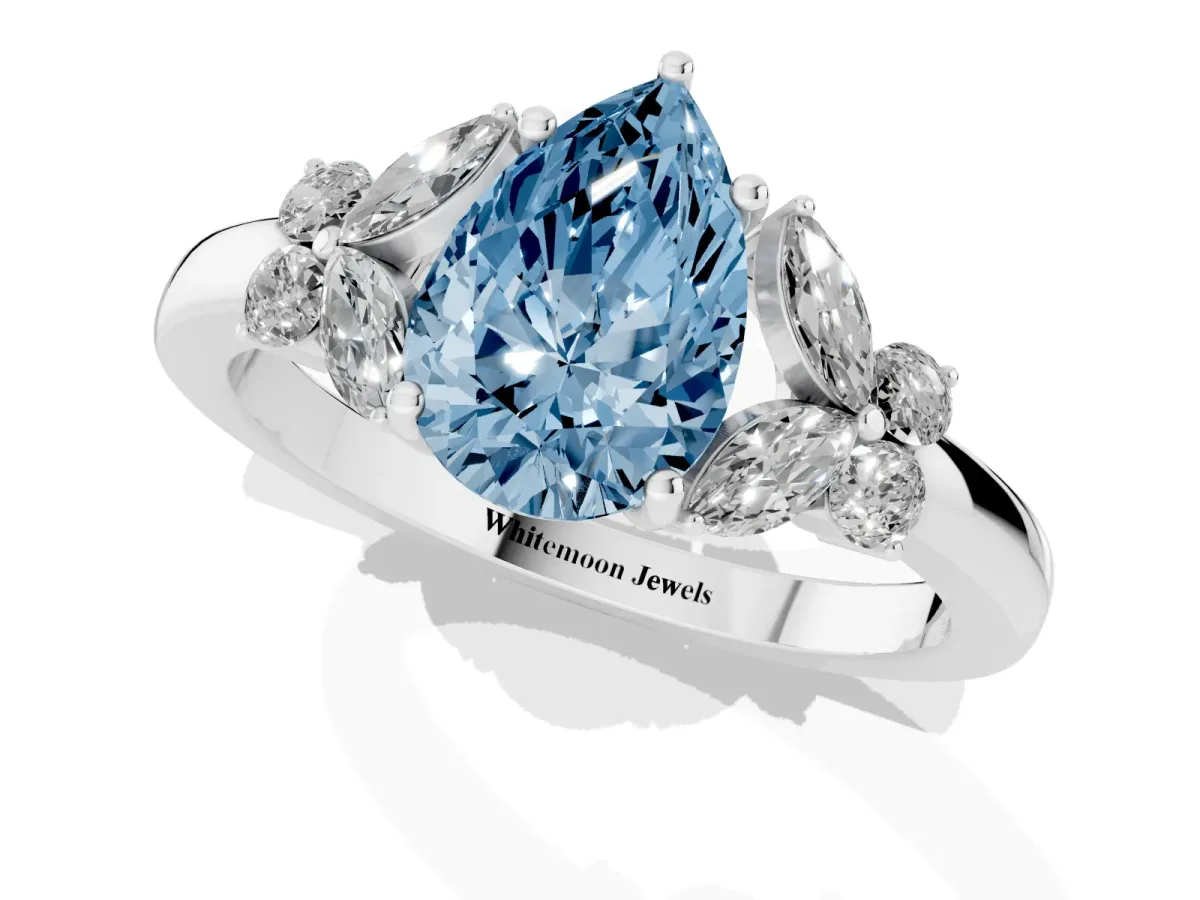 Fancy Blue Pear Cut Cut Solitaire Floral Diamond Ring with Four-Prong Setting Platinum