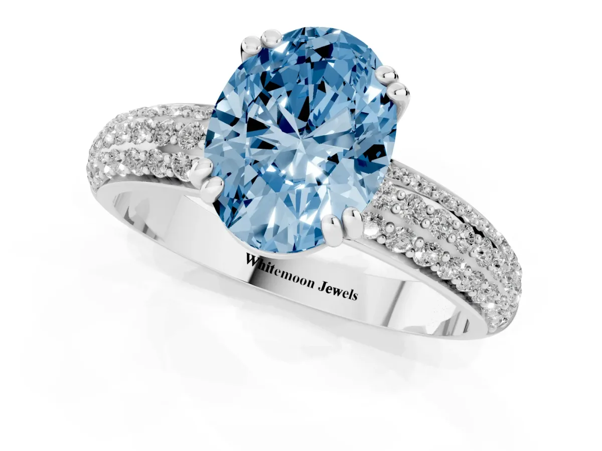 Fancy Blue Oval Cut Diamond Solitaire Ring with Multi-Row Round Pavé Band and Prong Setting Silver