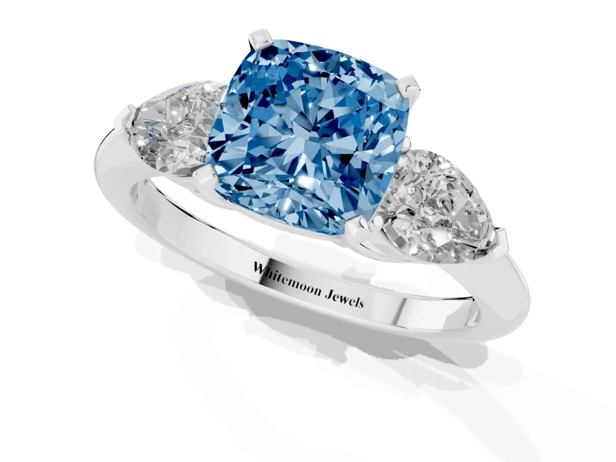 Fancy Blue Three-Stone Cushion Cut Diamond Ring with Pear Side Stones and Four-Prong Setting Platinum