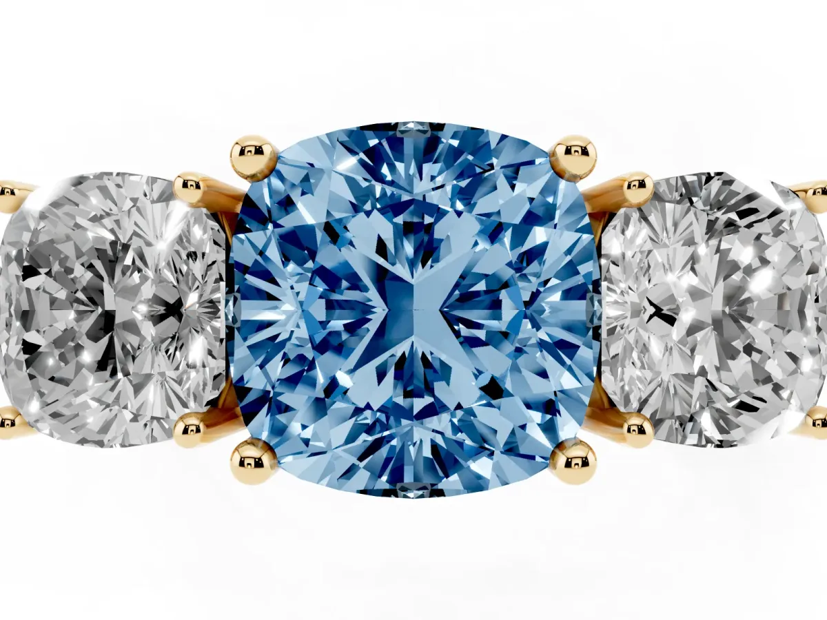 Fancy Blue Three-Stone Cushion Cut Cut Diamond Engagement Ring with Prong Setting on a White Gold Band Yellow gold