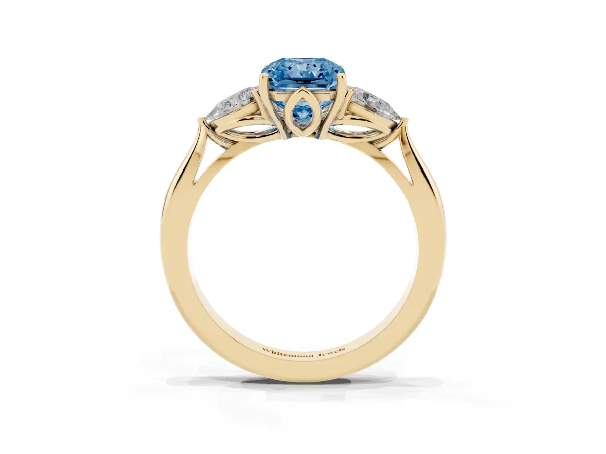 Fancy Blue Radiant Cut Diamond Three-Stone Ring with Pear Side Stones and Prong Setting Yellow gold