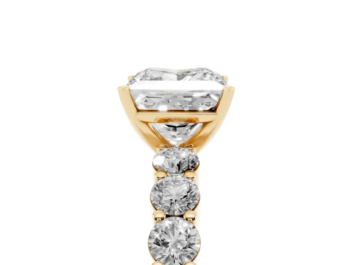 Princess Cut Diamond Solitaire Ring with Shared Prong Round Side Stones Yellow gold