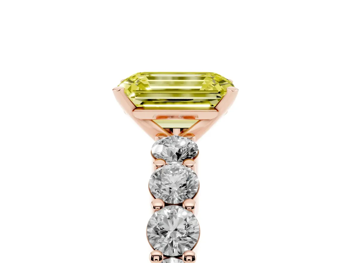Fancy Yellow Emerald Cut Diamond Solitaire Ring with Shared Prong Round Side Stones Rose gold