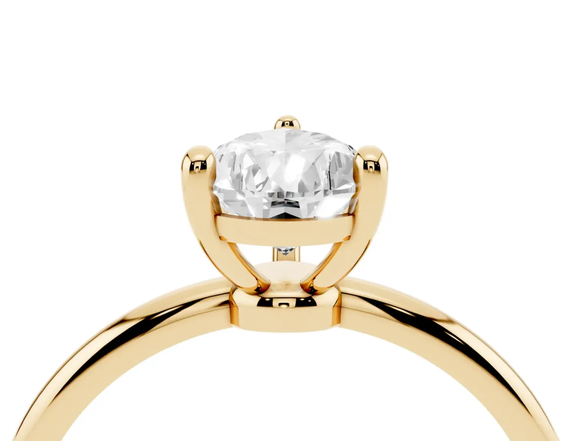 Pear Cut Solitaire Diamond Ring with 4-Prong Setting on a Classic Band Yellow gold