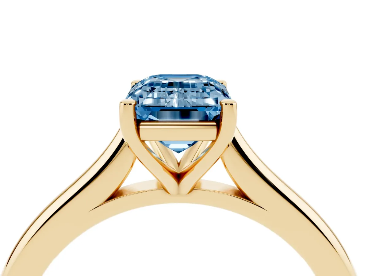 Fancy Blue Emerald Cut Cut Solitaire Ring with Cathedral Band and Four-Prong Setting Yellow gold