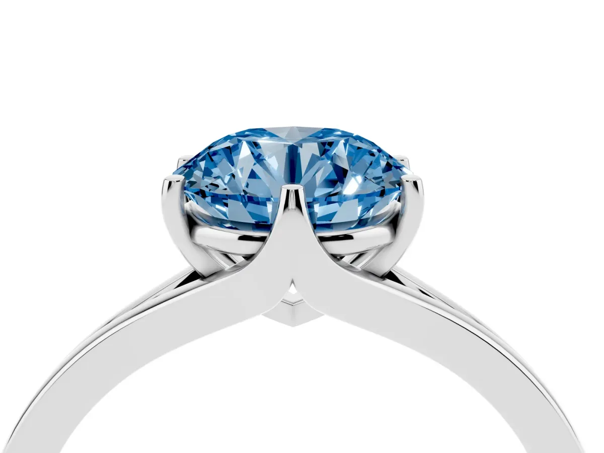 Fancy Blue Round Cut Solitaire Diamond Ring with Six-Prong Setting and Tapered Band Silver
