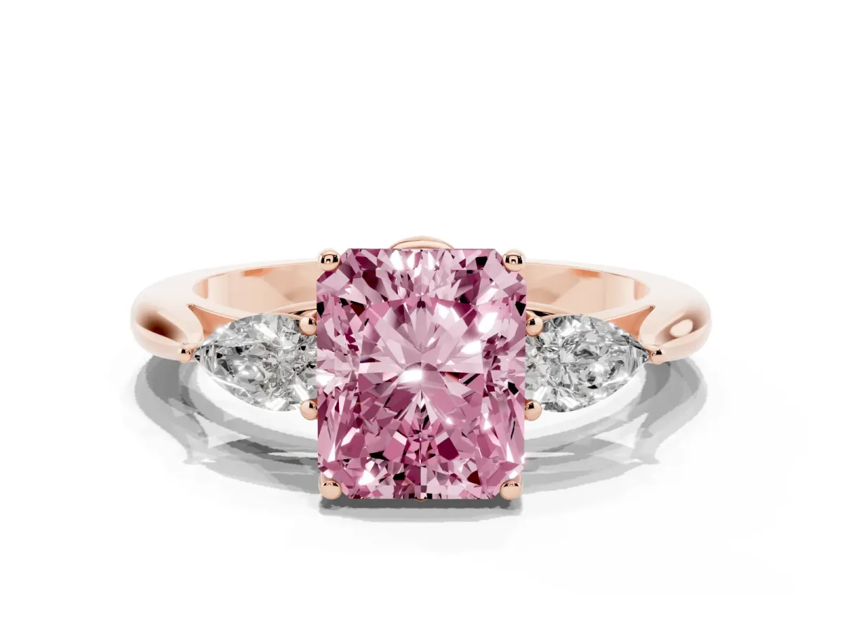 Fancy Pink Three-Stone Radiant Cut Diamond Ring with Pear Side Stones in Four-Prong Setting Rose gold