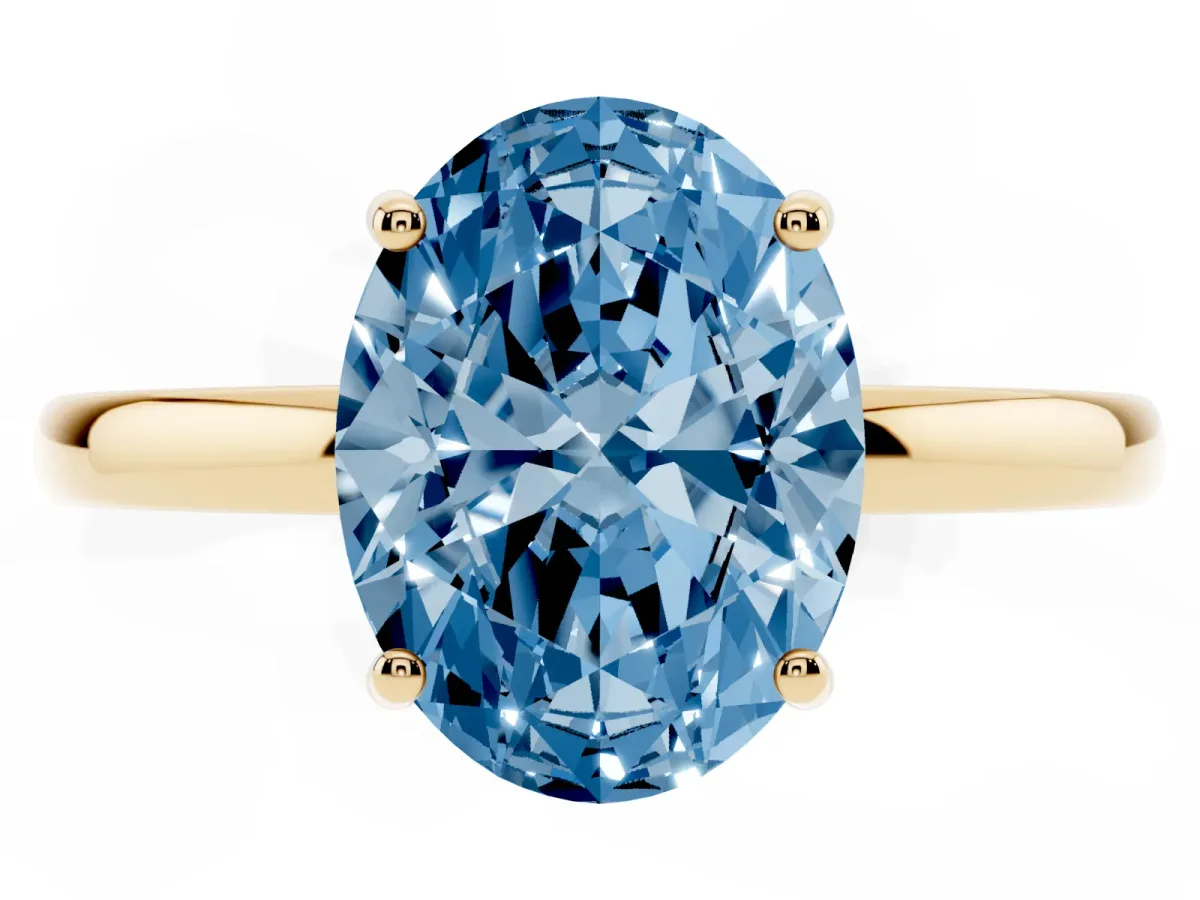 Fancy Blue Oval Cut Solitaire Diamond Ring with Prong Setting and Plain Band Yellow gold