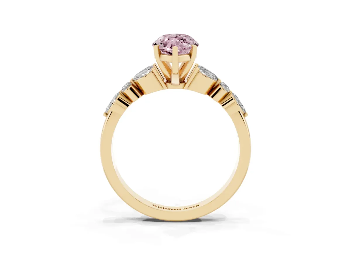 Fancy Pink Marquise Cut Diamond Solitaire Ring with Side Stones and Four-Prong Setting Yellow gold