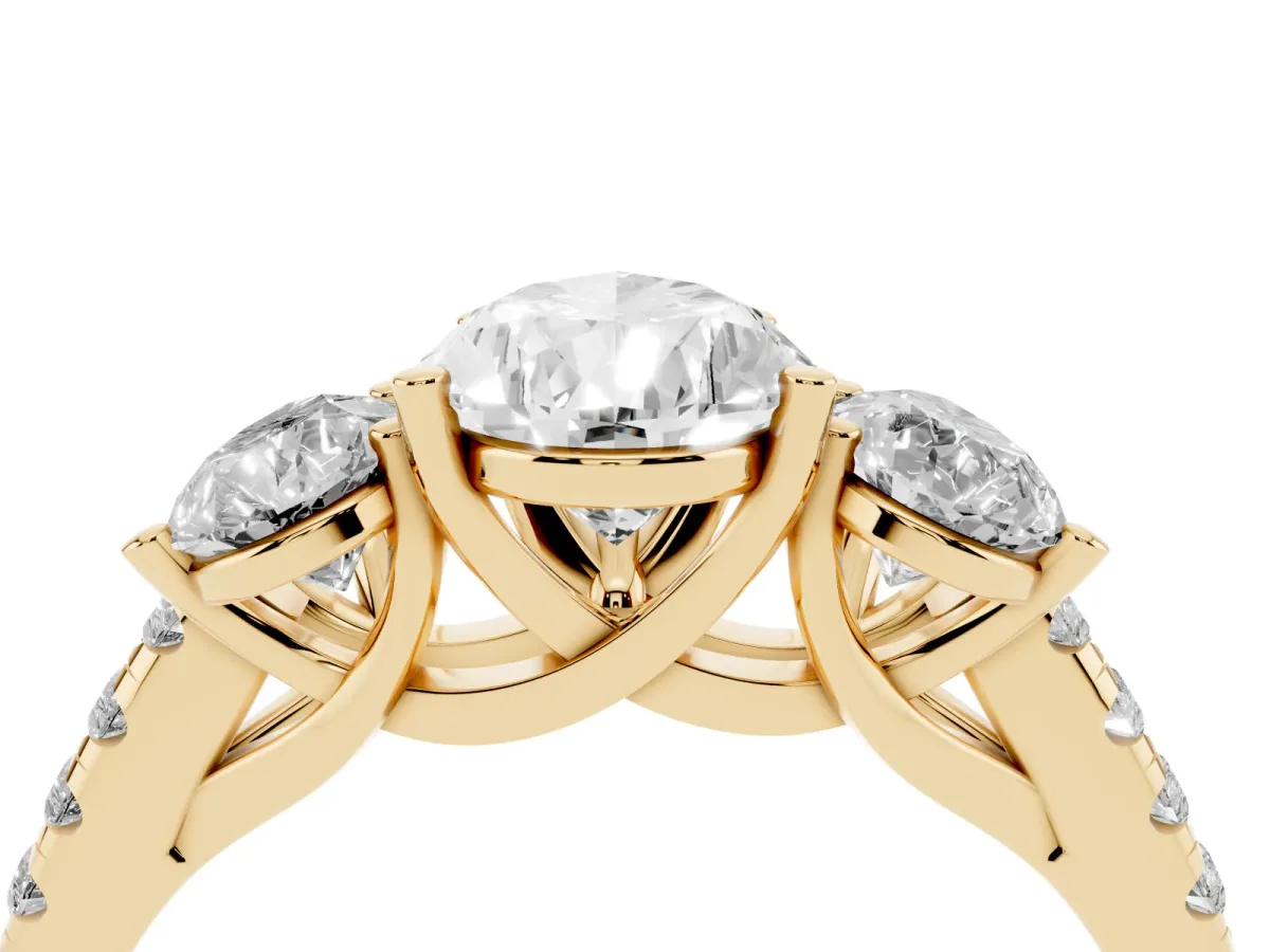 Three-Stone Pear Cut Diamond Ring with Round Pavé Band and Prong Setting Yellow gold