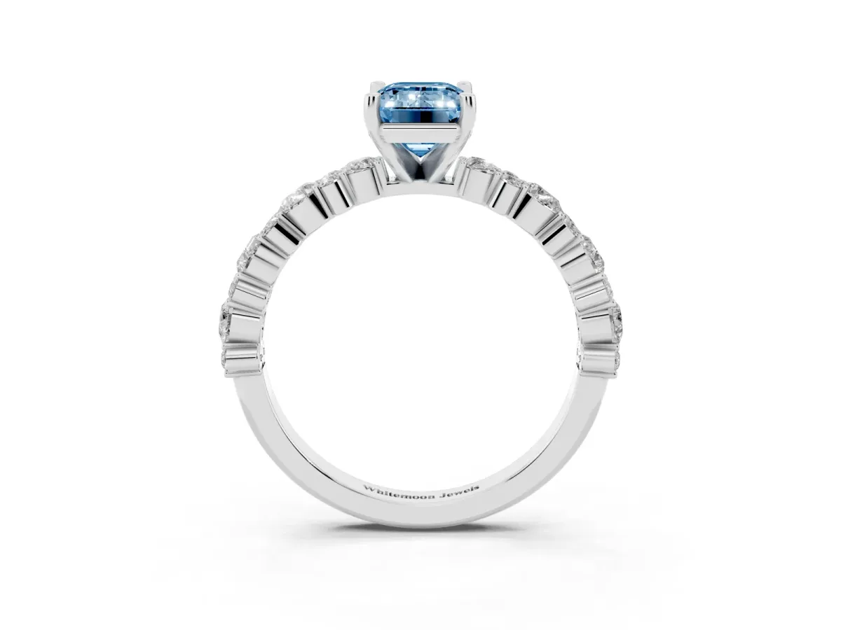 Fancy Blue Emerald Cut Diamond Side Stone Solitaire Ring with Round and Four-Prong Setting White gold