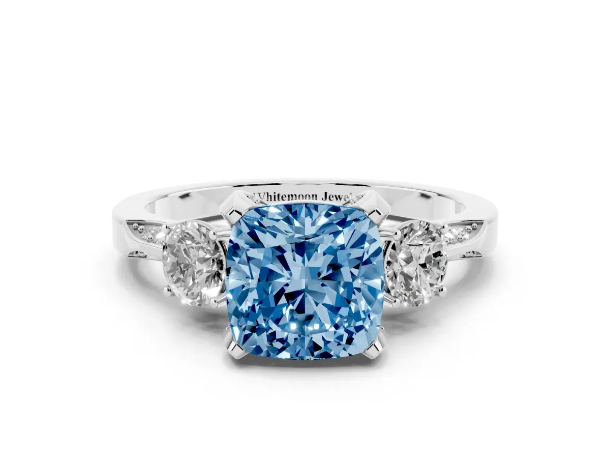 Fancy Blue Cushion Cut Brilliant Three-Stone Diamond Ring with Pavé Band and Four-Prong Setting White gold