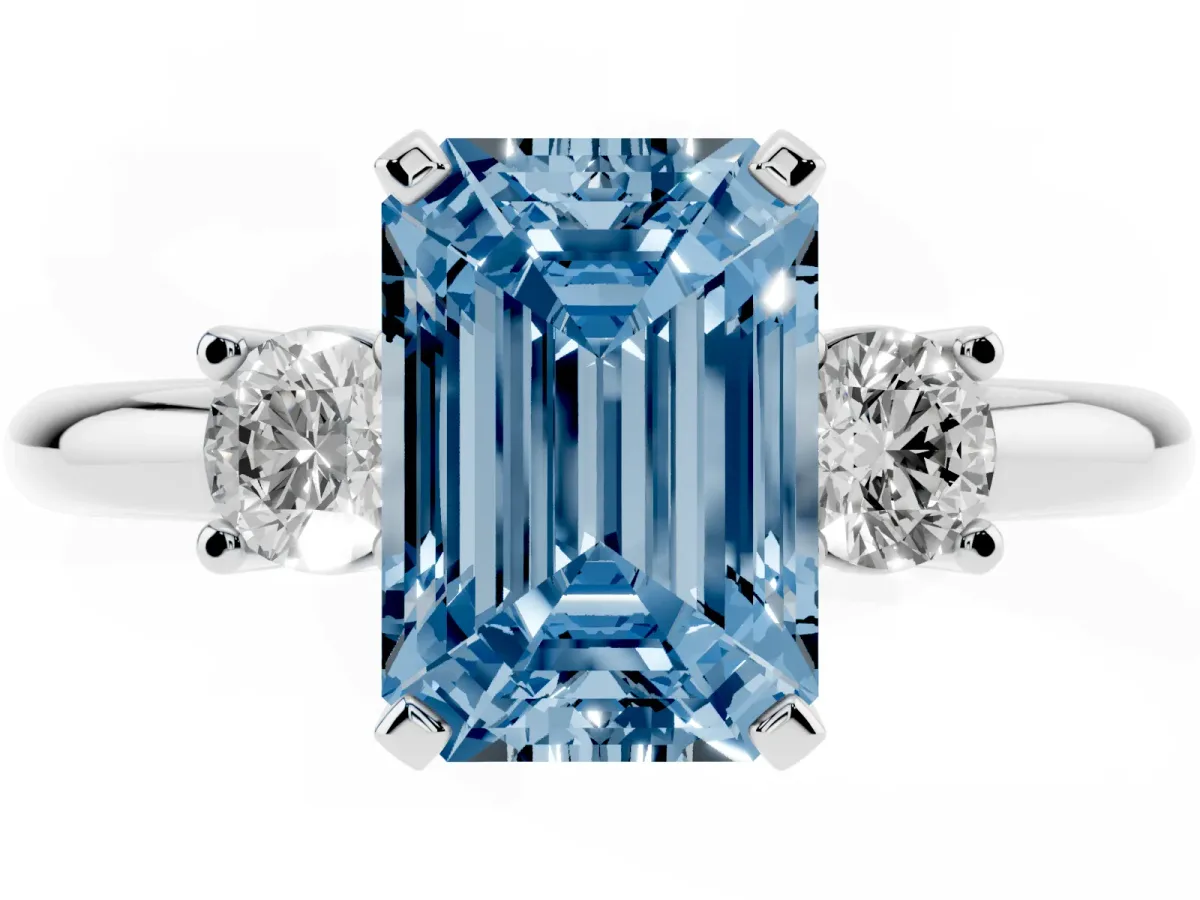 Fancy Blue Three-Stone Emerald Cut Cut Diamond Solitaire with Prong Setting and Classic Band Silver