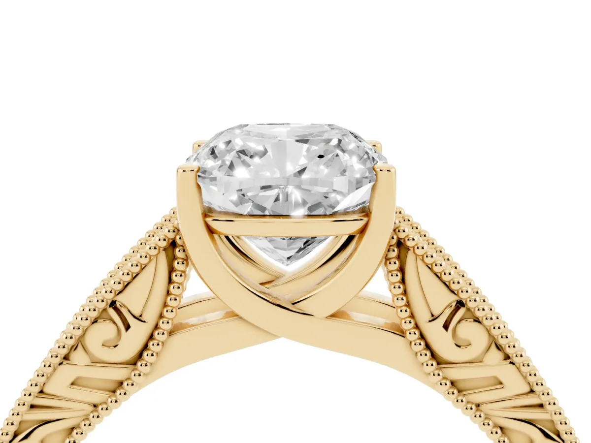 Cushion Cut Diamond Solitaire Ring with Engraved Band and Four-Prong Setting Yellow gold