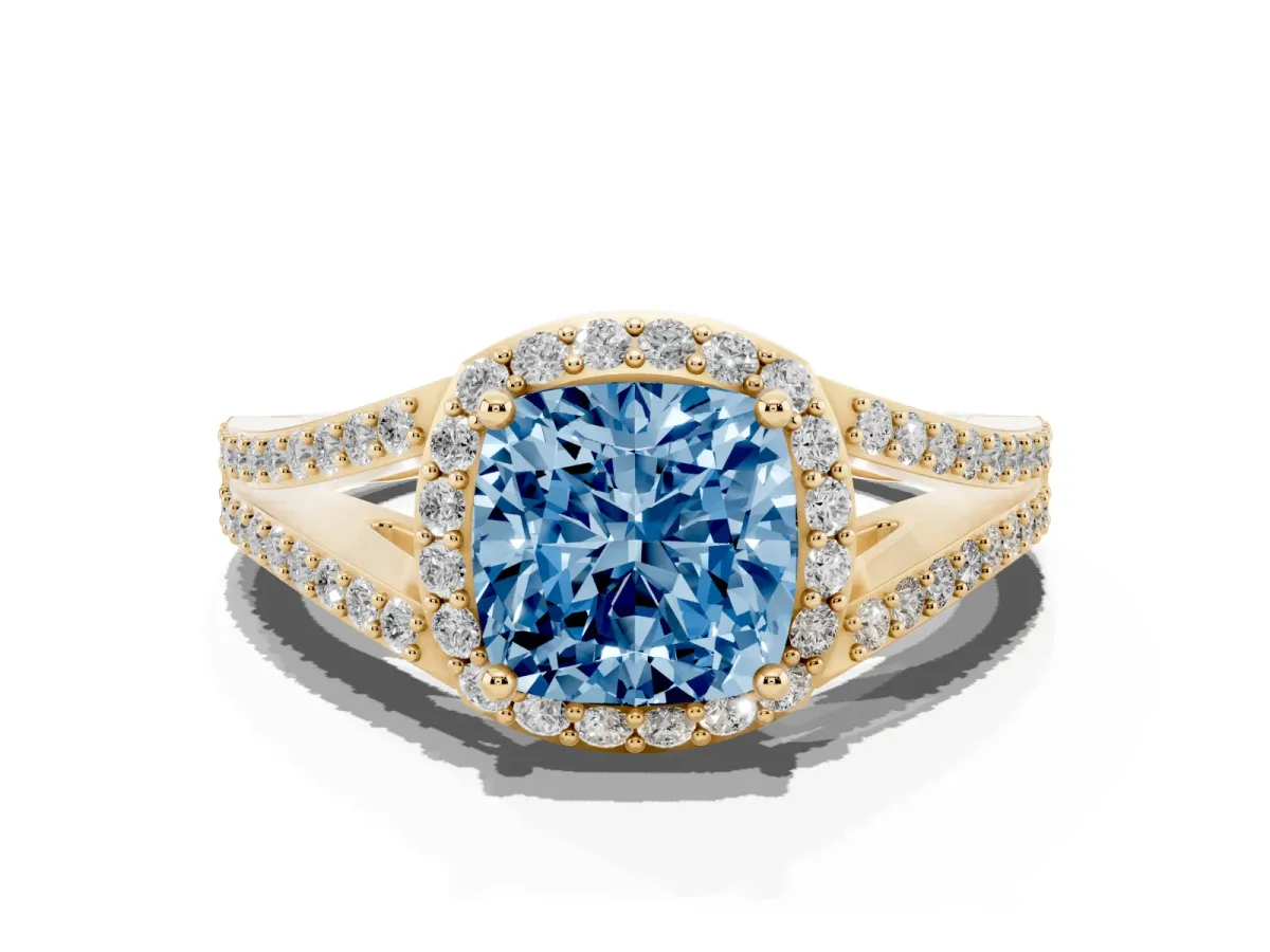 Fancy Blue Cushion Cut Halo Split Shank Pave Diamond Ring with Four-Prong Setting Yellow gold
