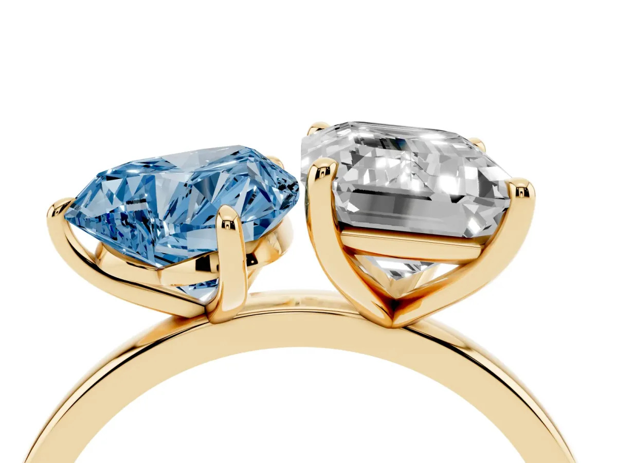 Fancy Blue Heart Cut and Emerald Cut Toi Moi Ring with Prong Setting Yellow gold