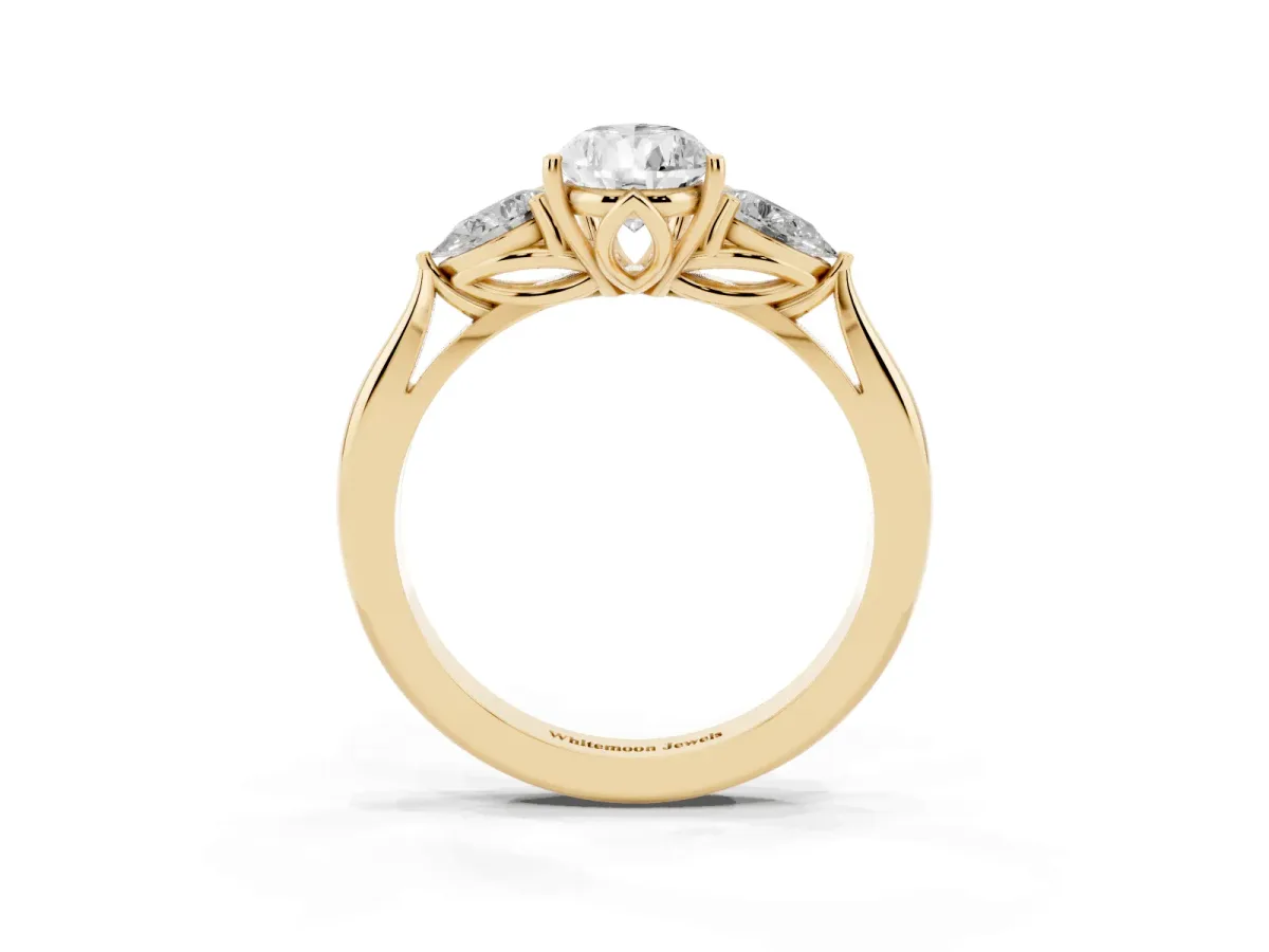 Three-Stone Pear Cut Brilliant Diamond Solitaire Ring with Tapered Band and Four-Prong Setting Yellow gold